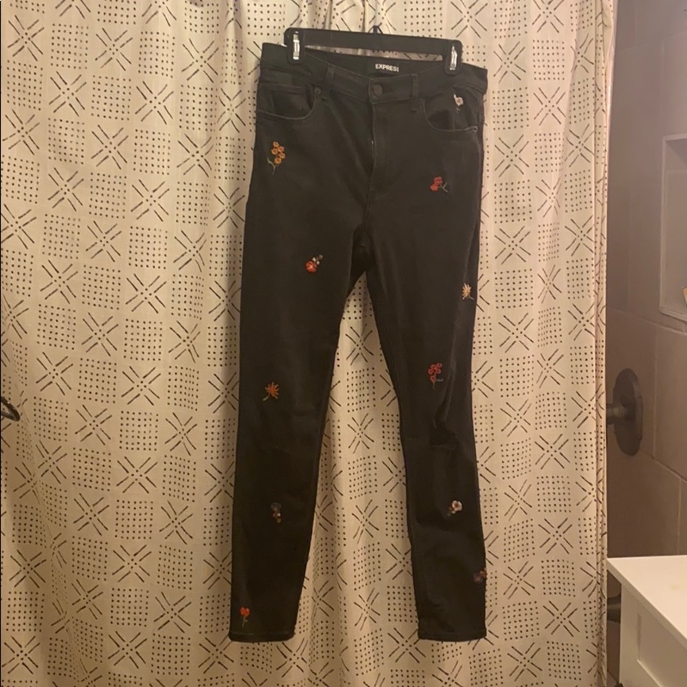 Express black skinny jeans with embroidered flower